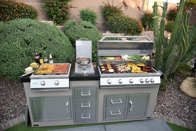 Outdoor kitchen with a stainless built-in grill